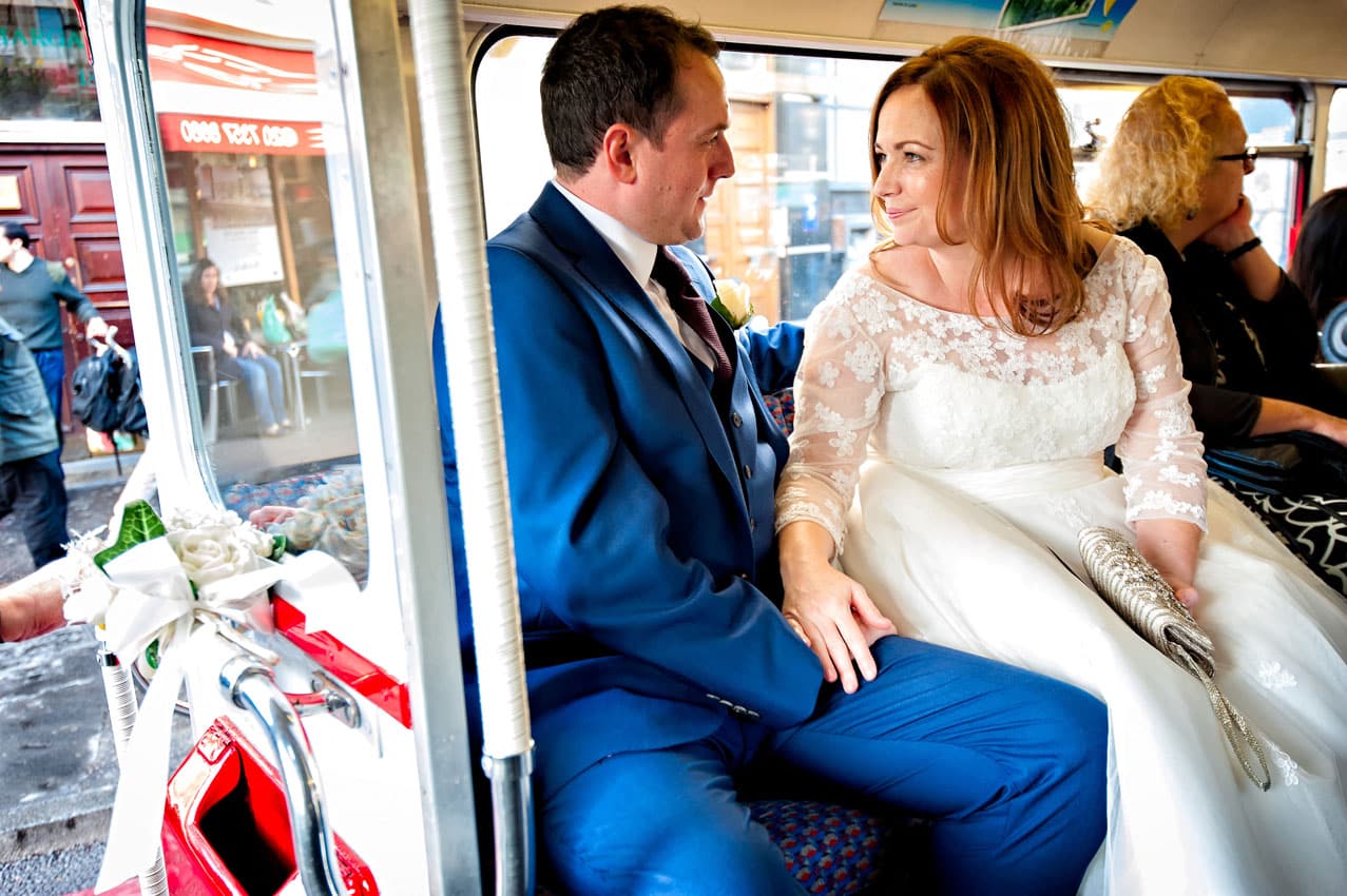Noewly-weds Looking at Each Other on Double Decker Bus